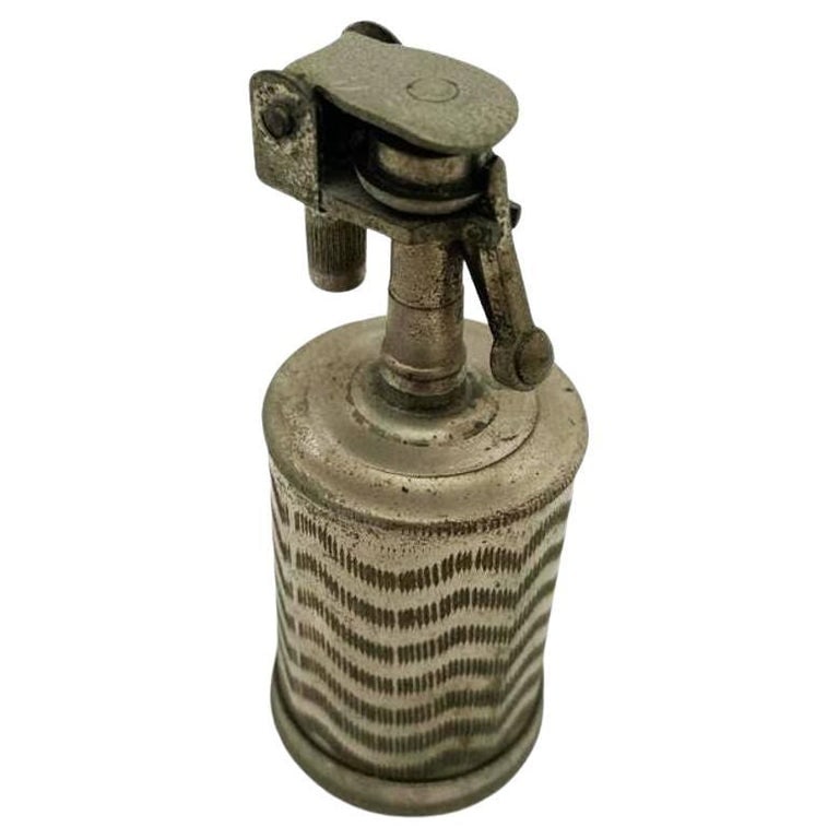 Hand Etched Cylinder Table Lighter, Circa 1930: Art Deco era Etched zigzag steel cylinder Lighter named "The Executive" By AR. Circa 1930, Measures: 3.5" tall X 2" diameter. Reserve: $165.00 Shipping: Domestic: Shipping rates are determined by