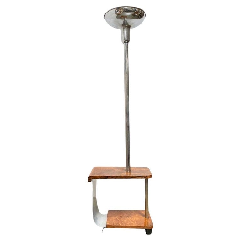 Art Deco Chrome & Wood Torchiere Floor Lamp End Table: A rare original art deco side table with built-in chrome torchiere floor lamp. This table features 2 tiers of sculpted hardwood with a unique piece of polished aluminum and fixed near its center is a 