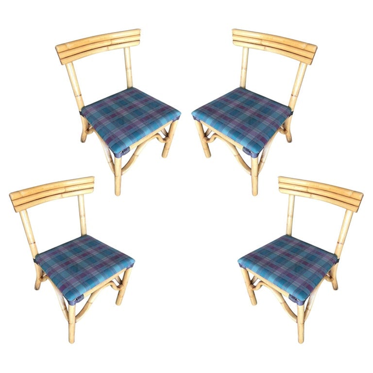 Restored Midcentury Rattan Dining Side Chair with Three-Strand Back, Set of 4: Vintage rattan dining room side chair with three strands "Speed" back, included is a set of four chairs. Each chair features a three-pole rattan "Speed" back seat back with an original plaid bark clot