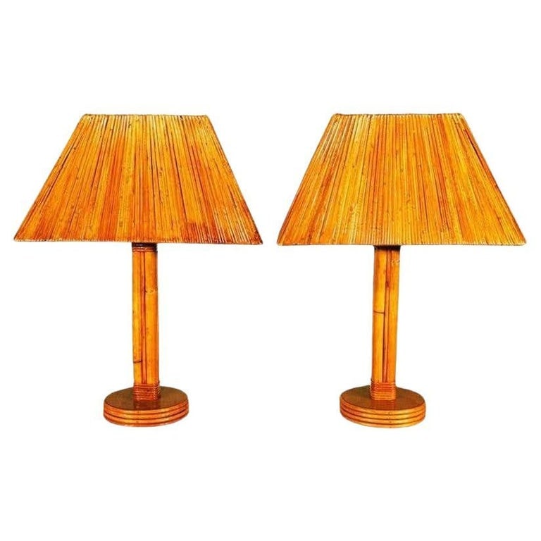 Restored Rattan Lamps with Rare Split Rattan Lamp Shade, Pair: Pair of Four pole rattan lamps with brass nailhead accents are circa the 1950s. These lamps include Rare lamp shades composed of rattan that has been split and stripped into thin pieces and brought to