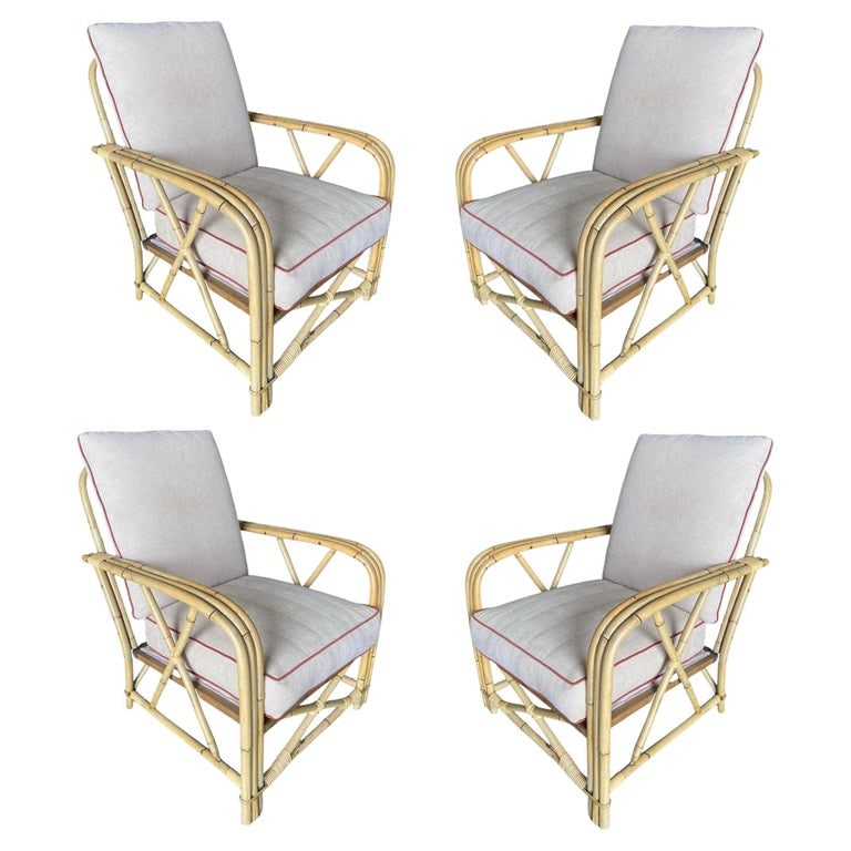 Rare Restored "1949er" Rattan Lounge Chair for Ficks & Reed Set: A Set of four Three-strand "1949er" rattan living-room lounge chairs by Ficks Reed features decorative arched X arms and X base. Chair: 33" tall x 26" wide x 32" deep Restored to new for you. We only