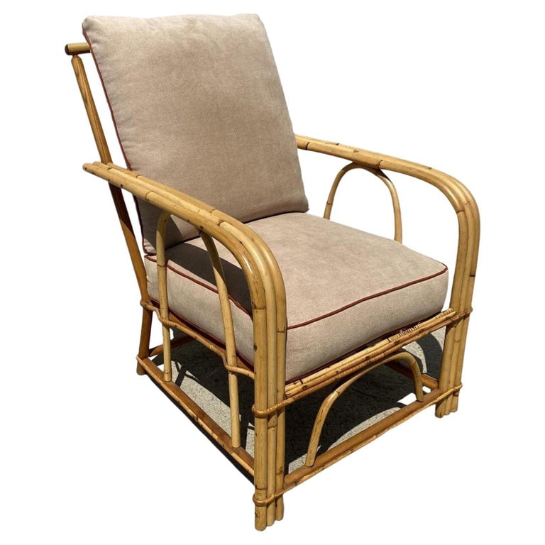 Restored "1949er" Rattan 3-Strand Lounge Chair by Heywood Wakefield: Three-strand "1949er" rattan living-room lounge chair by Heywood Wakefield features decorative arched u arms and arched base. Great example of early post-war American rattan furniture. Chair: 33"