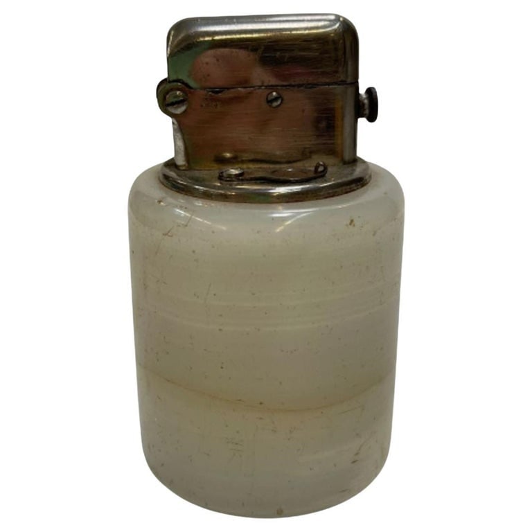 Hand Polished White Agate and Chrome Table Lighter, circa 1930: 1930s bouquet hand-polished white agate chrome steel table lighter with an auto flip mechanism. Perfect for the home lounge or small bar. 1930, United states. Reserve: $225.00 Shipping: Domestic: