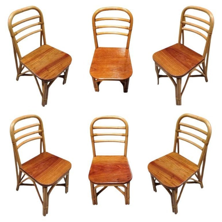 Restored Midcentury Rattan Dining Side Chair with Mahogany Seat, Set of Six: Vintage rattan dining room side chair with a mahogany seat, included is a set of 5-chairs. Each chair features a three-strand rattan seat back with a mahogany seat. We only purchase and sell only the 
