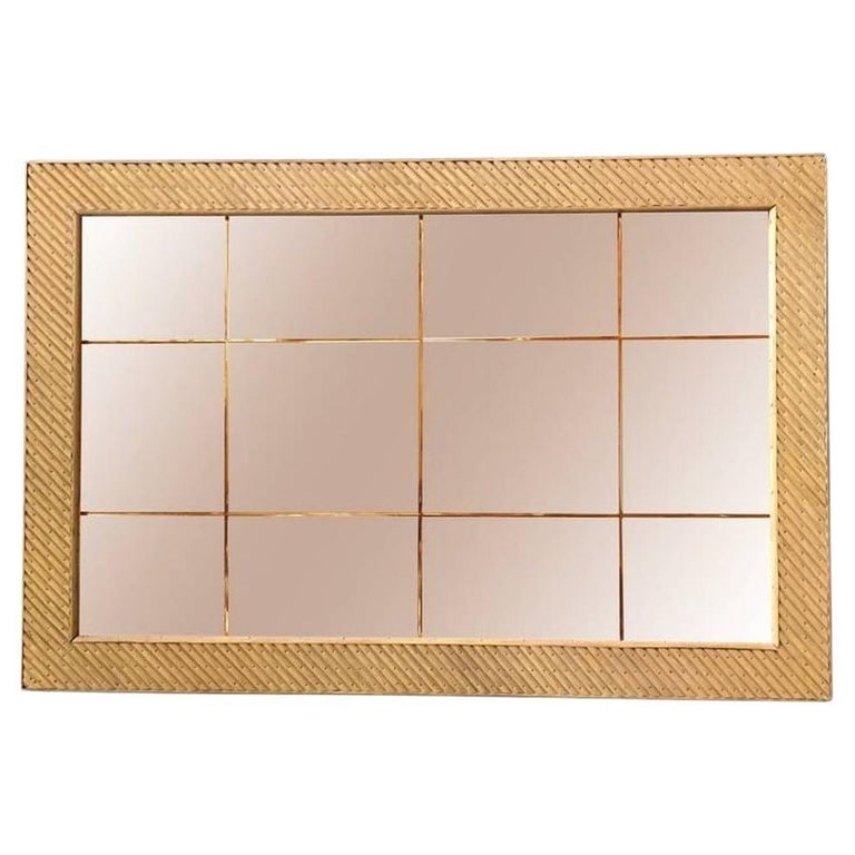 Restored Stick Rattan Rectangle Peach Glass Mirror with Nail Heads: Large rectangular peach glass mirror featuring a slanted cut stick rattan frame with decorative brass nail accents. Restored to new for you. 1950, United States We only purchase and sell the best and