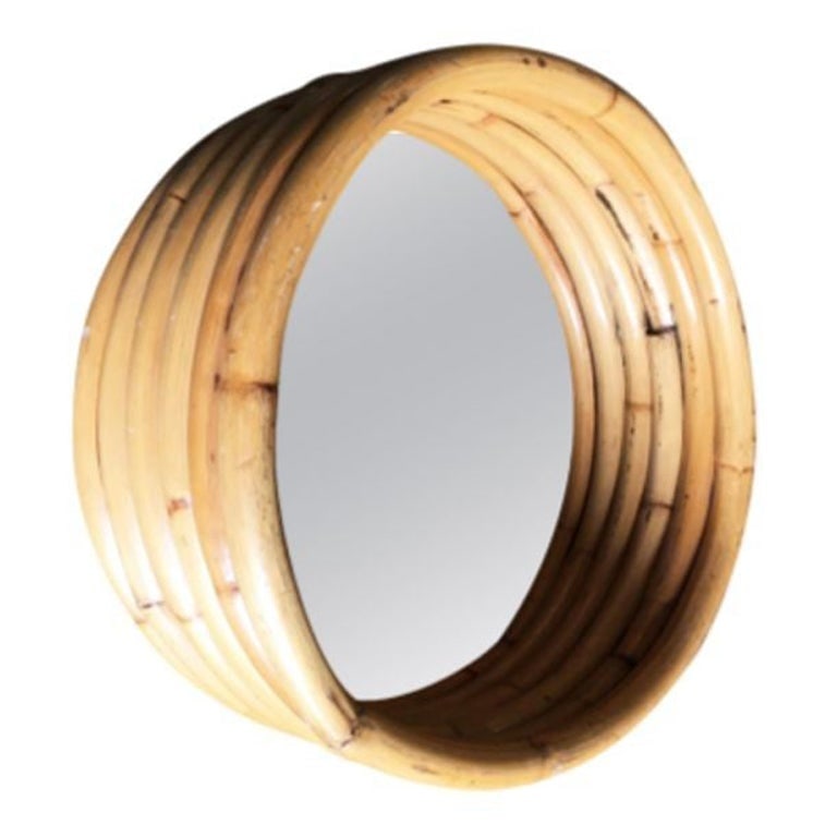 Restored Six-Strand Round 21" Porthole Wall Rattan Mirror: Original 21" round porthole mirror featuring a Deeep six-stand rattan frame 1950, United States Dimensions: 21" H x 21" W x 7" D We only purchase and sell the best and finest rattan furniture made by