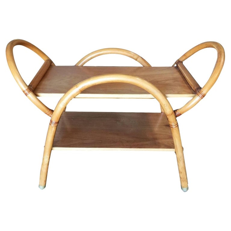 Restored Free-Form "Arches" Rattan Bar Cart W/ Mahogany Top: Unique Post War bar cart features free-form "Arches" designed with top and bottom Mahogany shelves. Unique to the "Arches" design is minimalist Popular Ball wheels consisting of metal balls in a fixtu