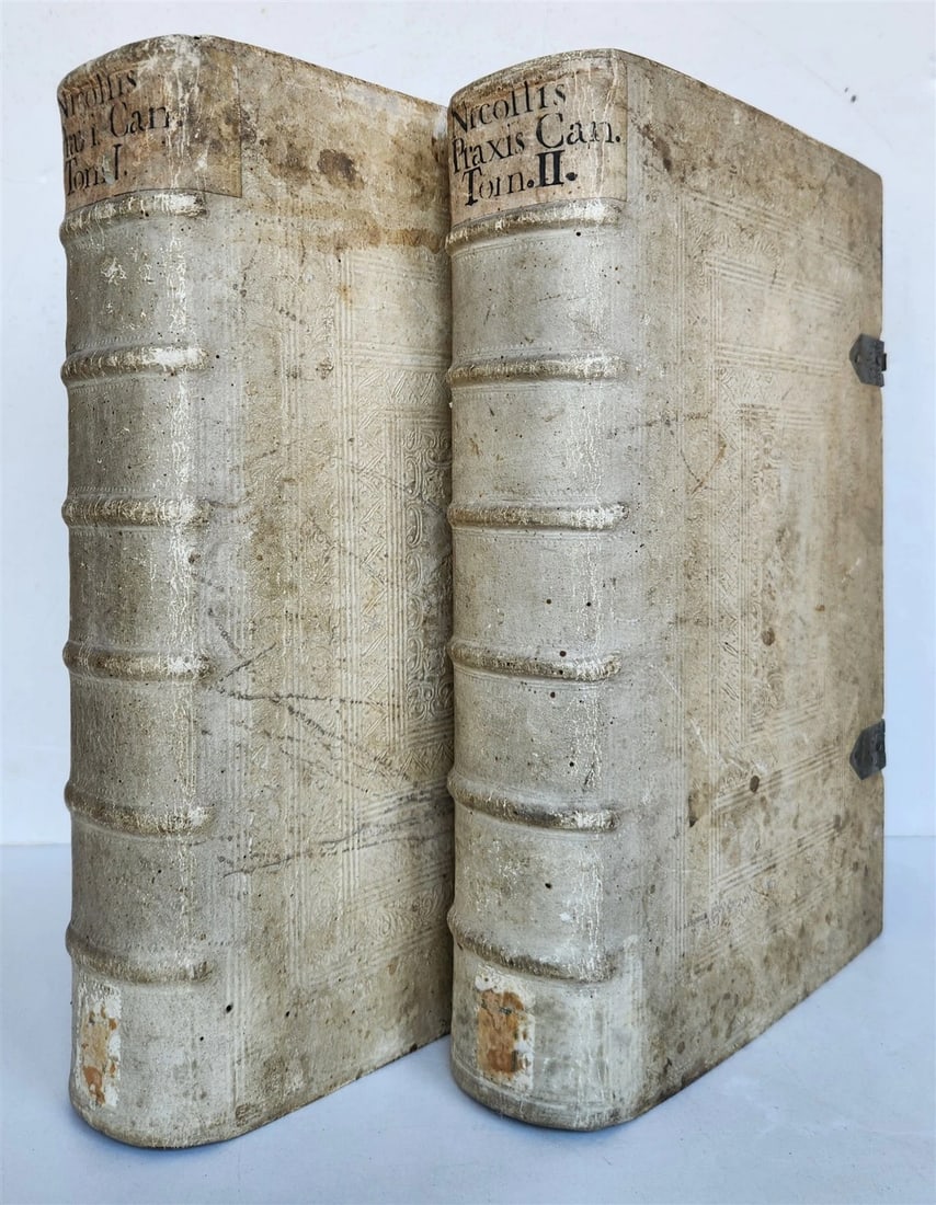 1729 CANON LAW antique 2 VOLUMES PIGSKIN BOUND FOLIO: Nicollis, L.V.de. Praxis canonica sive jus canonicum casibus practicis explanatum, constitutionibus apostolicis... cui accedit praxis romanae curiae. 2 volumes. Salzburg, Mayr; 1729 14 leaves, 886 pp.