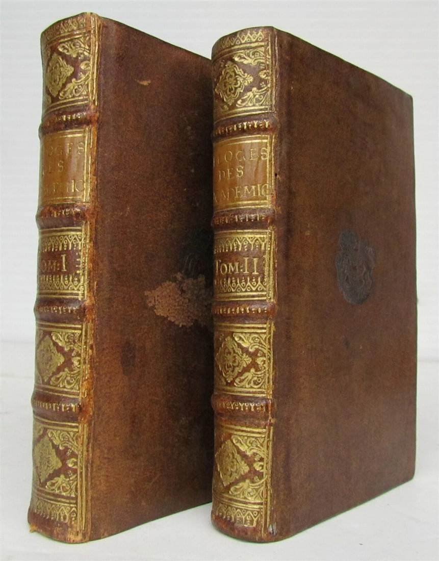 1731 2 volumes SCIENCE in FRENCH by Bernard Fontenelle antique: Eloges des Academiciens de l'Academie Royale des Sciences by M. de Fontenelle The Hague: Chez Isaac van der Kloot, 1731 2 volumes Size 4 1/4 by 6 3/4" Bound in original calf armorial bindings with