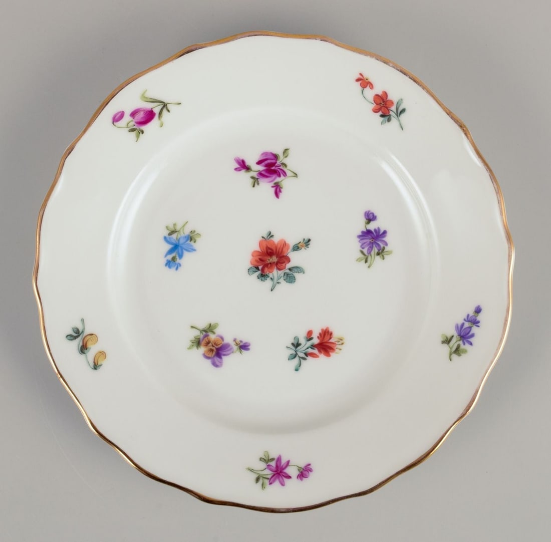 Silesia, Germany. Eight lunch plates in porcelain with floral motifs. Approx. 1930s. - 2