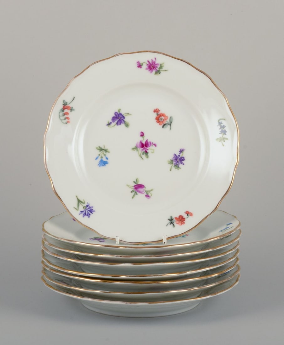 Silesia, Germany. Eight small porcelain lunch plates. Approx. 1930: Silesia, Germany. Eight small porcelain lunch plates. Hand-painted with floral motifs in polychrome colors, gold rim. Approximately 1930. Marked "Silesia". In excellent condition, with minor wear on