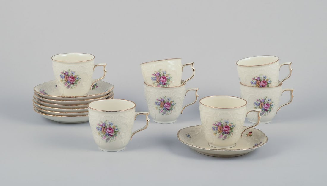 Rosenthal, seven-person "Sanssouci" coffee service. Decorated with polychrome floral motifs. Approx.: Rosenthal, a seven-person "Sanssouci" coffee service. Comprising seven coffee cups with matching saucers. Decorated with polychrome floral motifs. Approximately from the 1930s. In excellent condition