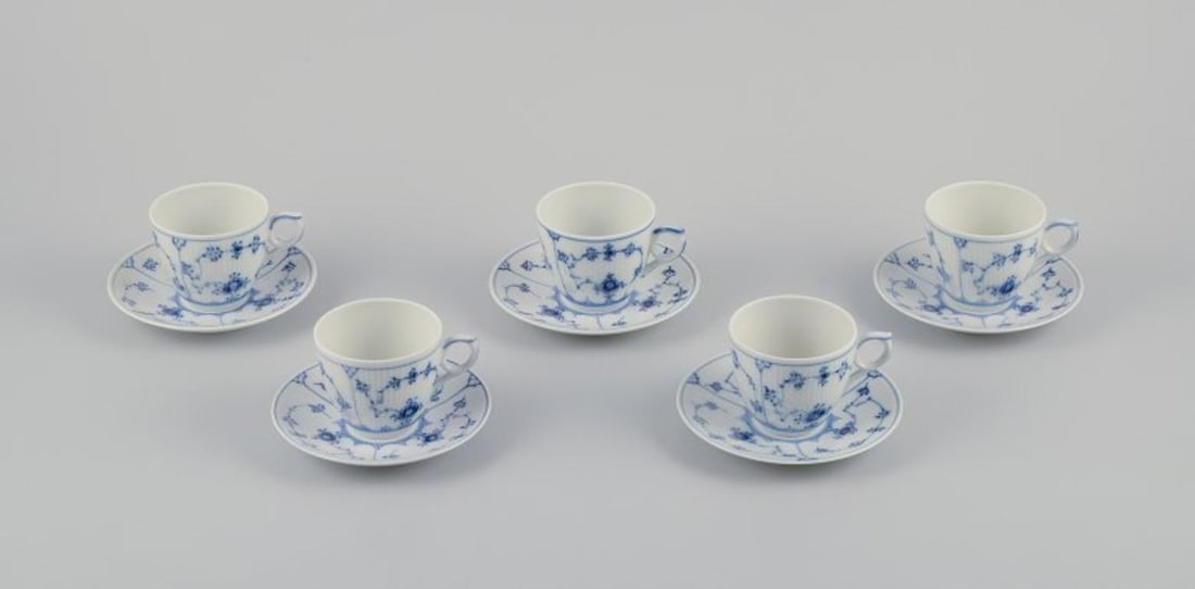 Royal Copenhagen Blue Fluted Plain. A set of five coffee cups with saucers.: Royal Copenhagen Blue Fluted Plain. A set of five coffee cups with saucers. Model number 1/2162. Dating: 1957 (2) and 1975-1979 (3). Marked. First factory quality. Perfect condition. Cup: Diameter