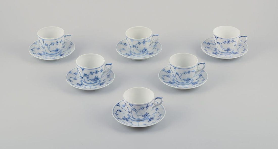 Royal Copenhagen Blue Fluted Plain. A set of six coffee cups with saucers in porcelain.: Royal Copenhagen Blue Fluted Plain. A set of six coffee cups with saucers. Model number 1/2162. Dating: 1954 (2), 1975-1979, 1991-1995, and 1996-2000 (2). Marked. Second to fourth factory quality.