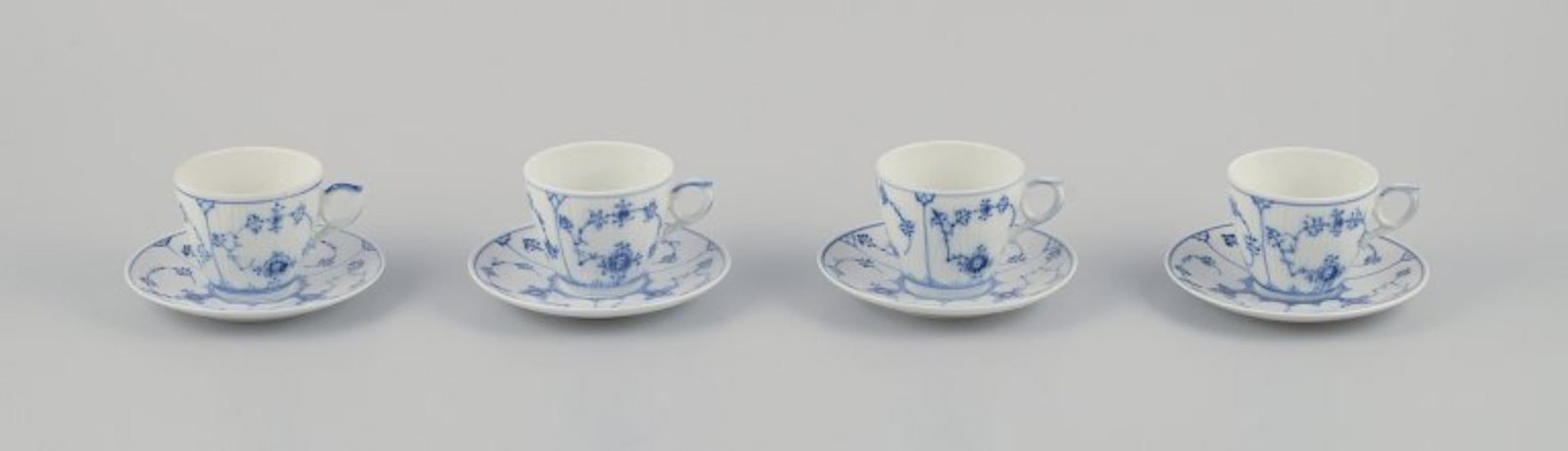 Royal Copenhagen Blue Fluted Plain. A set of four coffee cups with saucers. 1969-1974.: Royal Copenhagen Blue Fluted Plain. A set of four coffee cups with saucers. Model number 1/80. Dating: 1969-1974. Marked. Second to fourth factory quality. Perfect condition. Cup: Diameter 7.0 cm with