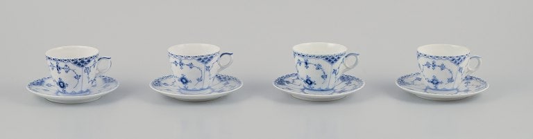 Royal Copenhagen Blue Fluted Half Lace. A set of four porcelain coffee cups with saucers.: Royal Copenhagen Blue Fluted Half Lace. A set of four coffee cups with saucers. Model number: 1/719. Dating: Approximately 1930 (2), 1956, and 1963. In perfect condition. Marked. First factory quality
