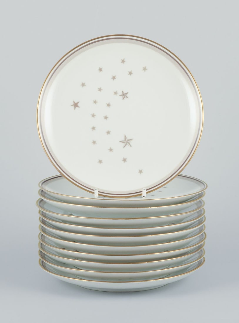 Bing and Grondahl, "Meƒe¦lkevej" ("Milky Way"). A set of eleven plates in porcelain. Gold: Bing and Grondahl, "Meƒe¦lkevej" ("Milky Way"). A set of eleven plates in porcelain. Gold decoration. Circa 1930s. Perfect condition. Marked. First factory quality. Dimensions: Diameter 17.7 cm.