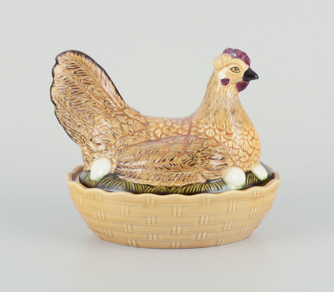 Porcelain hen bowl. Probably Germany. Mid-20th century.: Porcelain hen bowl. A lid in the shape of a hen sitting on a nest. Probably Germany. Mid 20th century. Model number 4774 on bottom. Excellent condition. Dimensions: L 21.0 cm. x Height 17.5 cm