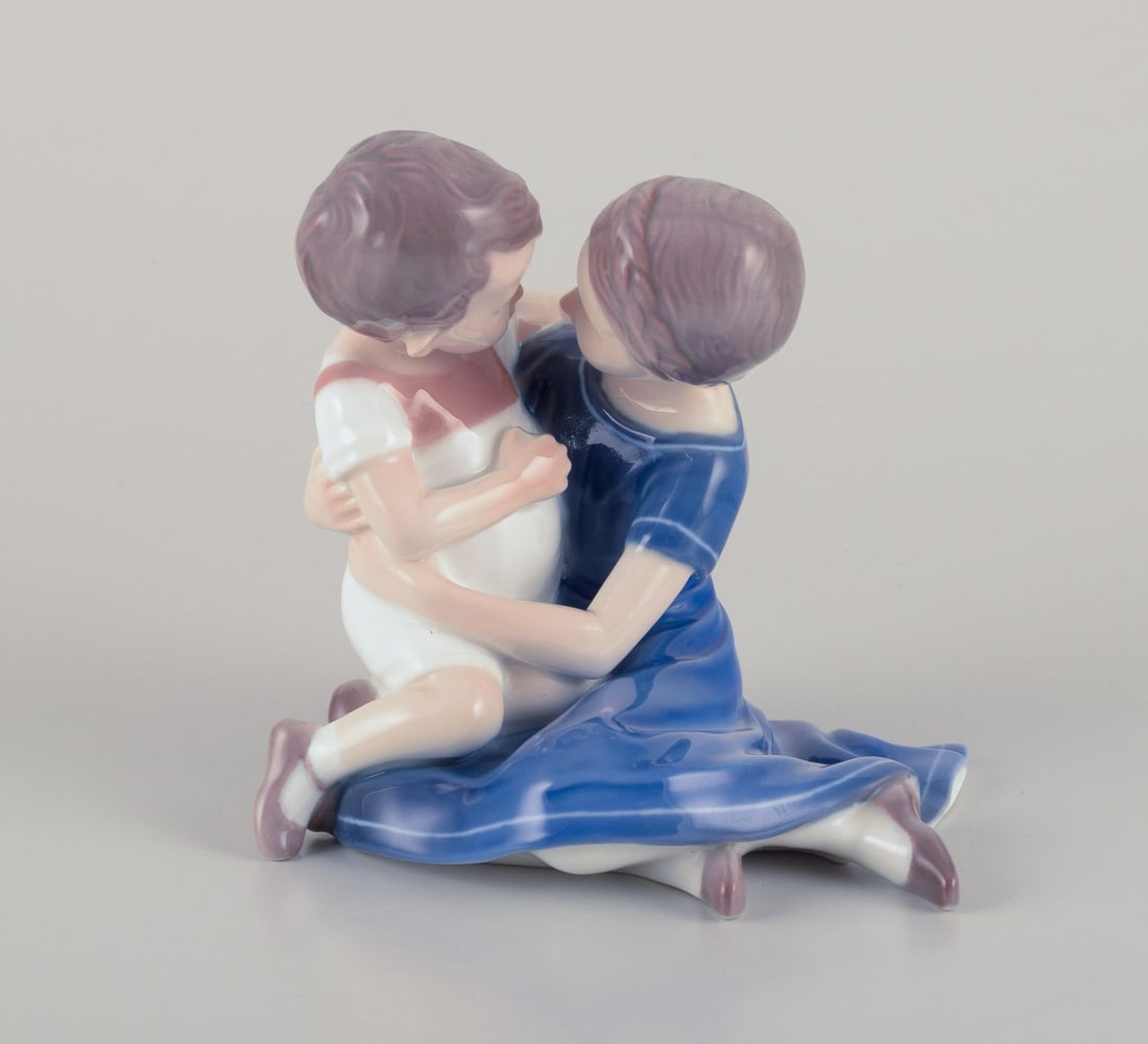 Bing & Grondahl, porcelain figurine of mother and boy. 1920s/30s.: Bing & Grondahl, porcelain figurine of a mother and a boy. Number 1568. Dating 1920/30s. Marked. First factory quality. In perfect condition. Dimensions: W 12.0 cm. x H 12.0 cm. Reserve: $140.00