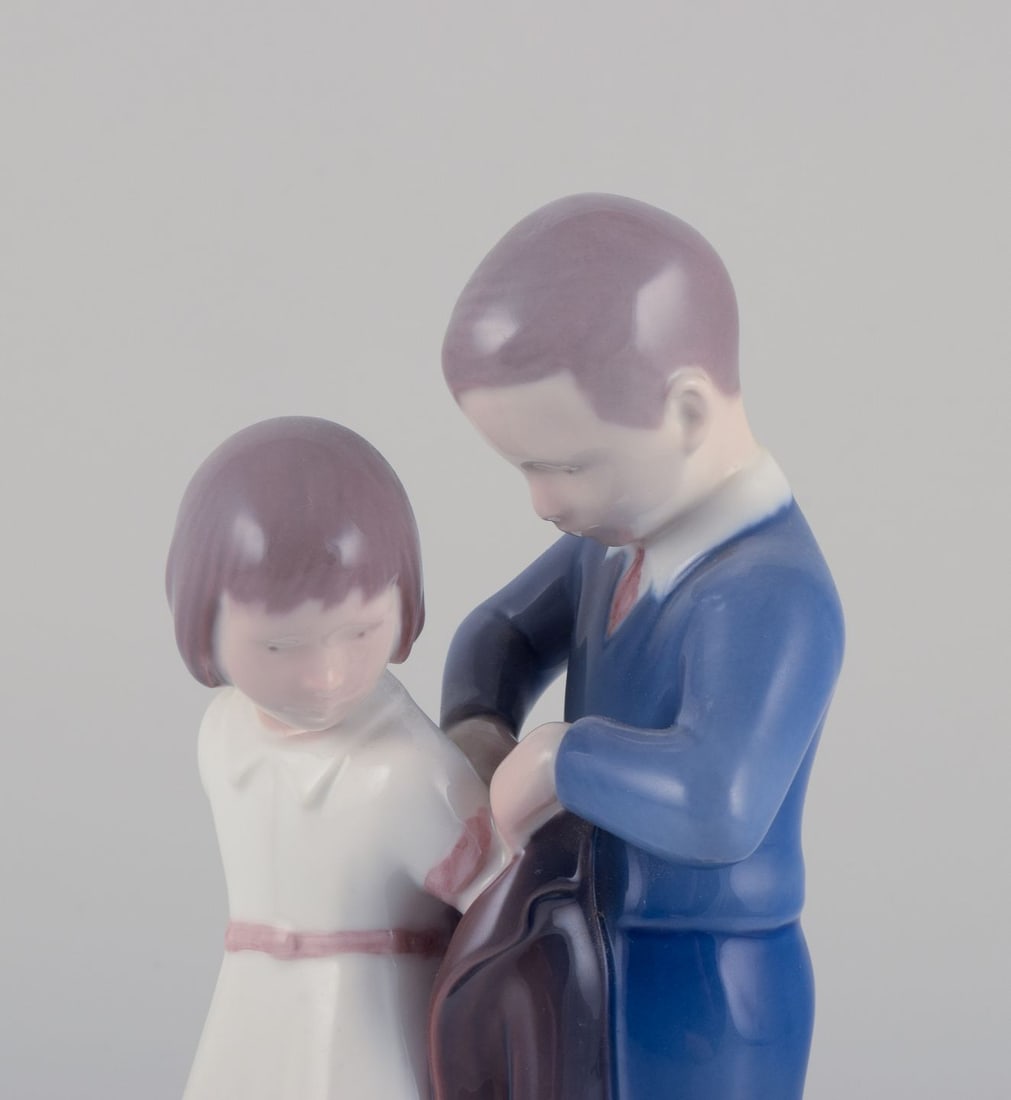 Bing & Grondahl, porcelain figurine. Boy helping girl with her jacket. Ca. 1930s - 3