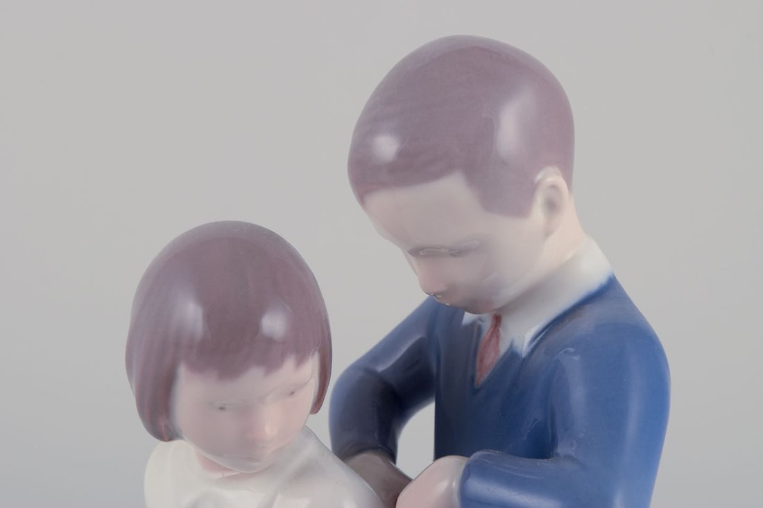 Bing & Grondahl, porcelain figurine. Boy helping girl with her jacket. Ca. 1930s - 4