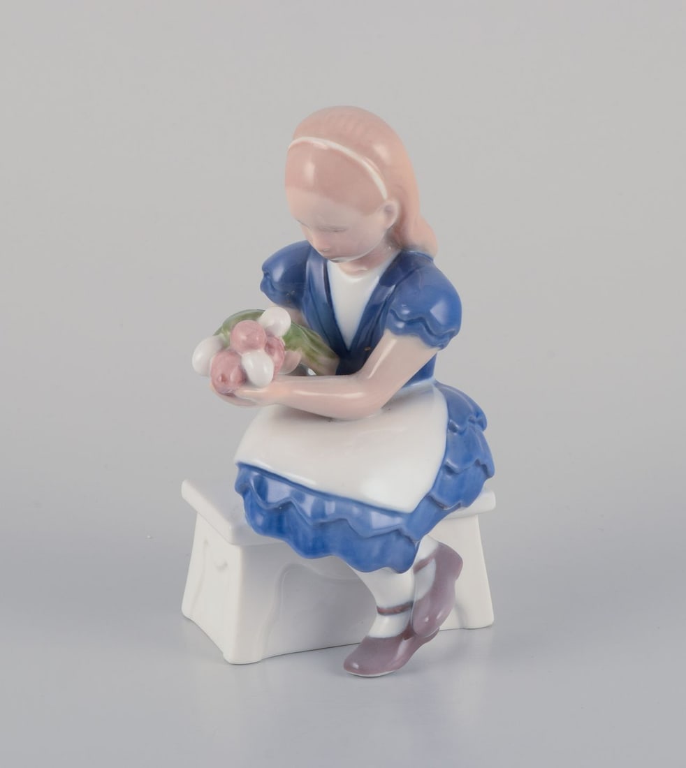 Bing & Grondahl, Denmark. Porcelain figurine of a seated girl with a bouquet of flowers, 1930s: Bing & Grondahl, Denmark. Porcelain figurine of a seated girl with a bouquet of flowers in her arms. "Idas flowers". Model no. 2298. Ca. 1930s. Marked. First factory quality. In perfect condition.