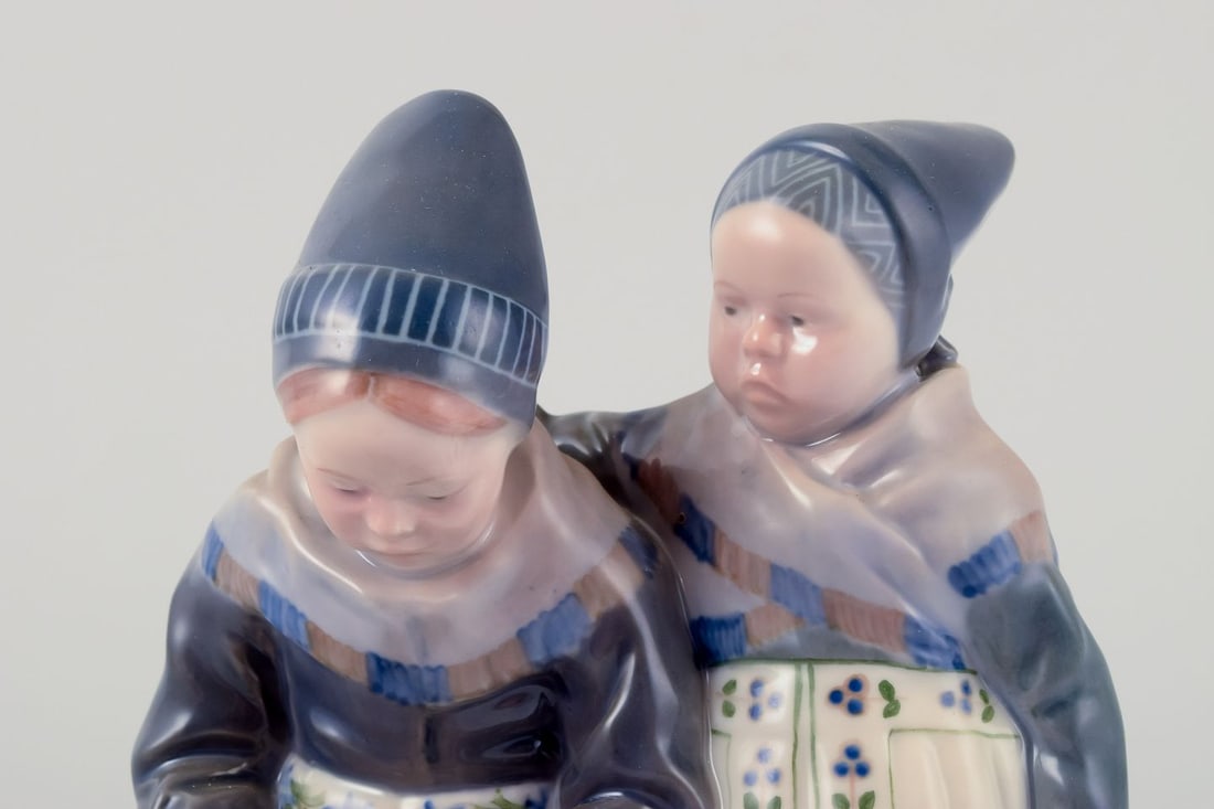 Royal Copenhagen figurine in porcelain. Two "Amager" girls in regional costume. Dated 1956 - 2