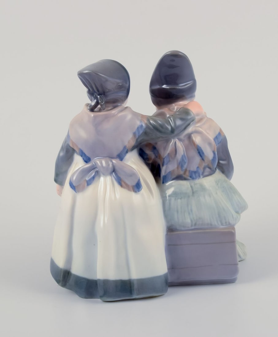 Royal Copenhagen figurine in porcelain. Two "Amager" girls in regional costume. Dated 1956 - 5