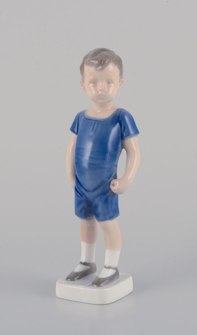 Bing & Grondahl, porcelain figurine of standing boy Ca. 1930s.: Bing & Grondahl porcelain figurine. Standing boy. Ca. 1930s. Model number: 1617. In perfect condition. Marked. First factory quality. Dimensions: H 20.0 cm. x 5.5 cm. Reserve: $140.00 Shipping: