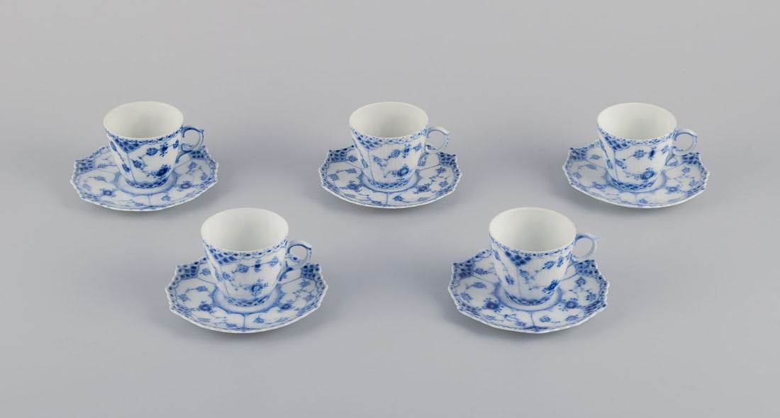 Royal Copenhagen Blue Fluted Full Lace. Five demitasse cups and saucers in porcelain. 1930s.: Royal Copenhagen Blue Fluted Full Lace. Five demitasse cups and saucers. Model number: 1/1038. Dating: 1930s. First and second factory quality. Perfect condition. Cup: Diameter 6.0 cm x Height 5.4 cm.