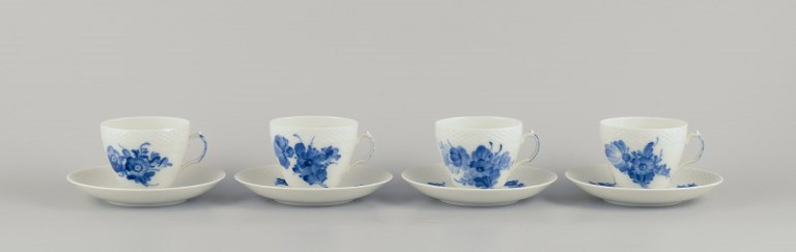 Royal Copenhagen, Blue Flower Braided. Four coffee cups with saucers in porcelain. Dated 1966: Royal Copenhagen, Blue Flower Braided, four coffee cups with saucers. Model number: 10/8261 Dating: 1966 Second factory quality. In perfect condition. Marked. Cup: Diameter 8.0 cm without handle x