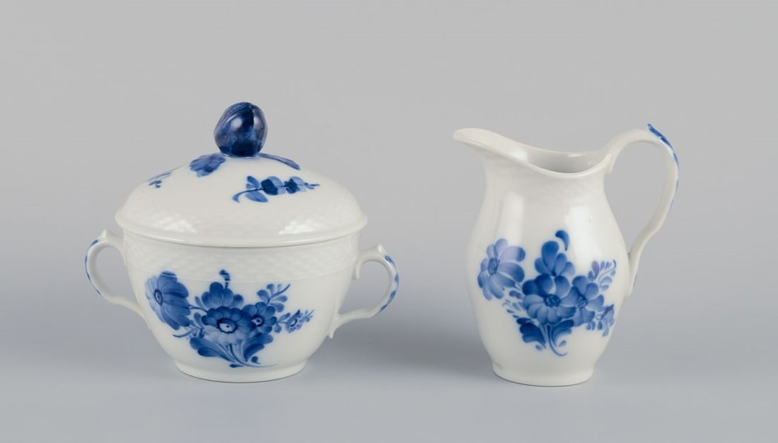 Royal Copenhagen Blue Flower Braided, creamer and sugar bowl in porcelain.: Royal Copenhagen Blue Flower Braided, creamer and sugar bowl. Model numbers: 10/8142 + 10/8026 Dating: 1975-1979 First factory quality. In perfect condition. Marked. Sugar bowl: Height 11.8 cm x