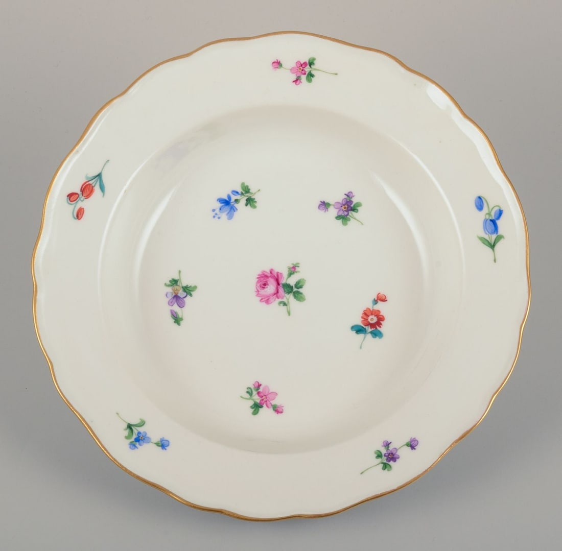 Meissen, Germany. A set of four deep plates in porcelain with polychrome floral motifs and gold rim. - 3