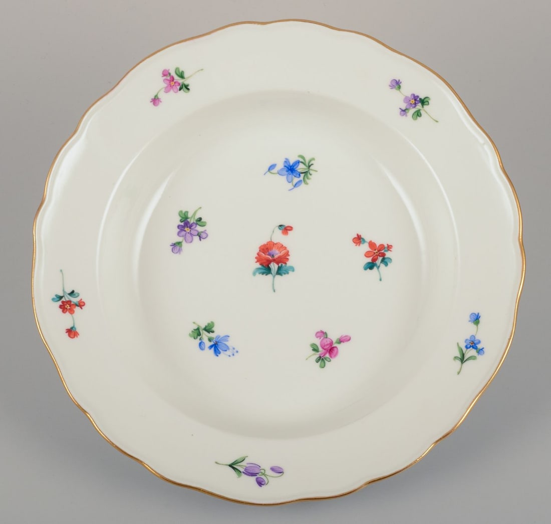 Meissen, Germany. A set of four deep plates in porcelain with polychrome floral motifs and gold rim. - 5