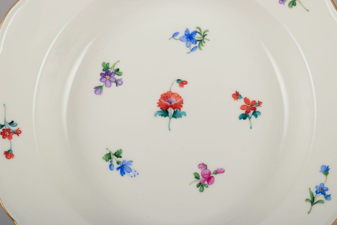 Meissen, Germany. A set of four deep plates in porcelain with polychrome floral motifs and gold rim. - 6