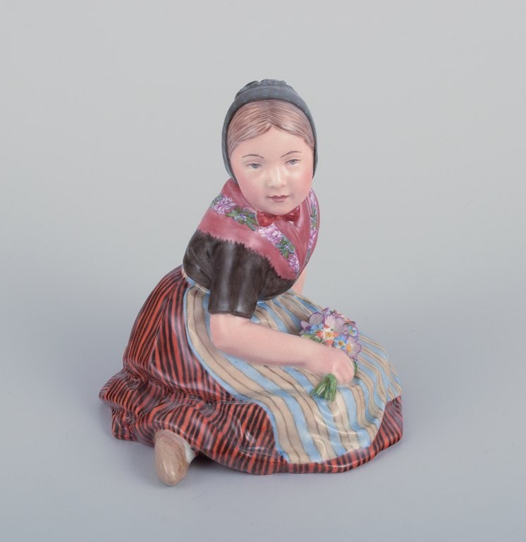 Royal Copenhagen, regional figurine of a girl from Faroe Islands. Overglaze. Dressed in regional: Royal Copenhagen, regional figurine of a girl from Faroe Islands. Overglaze. Dressed in regional costume and holding a bouquet of flowers. Model: 12416. Juliane Marie mark. Approximately from the 1930