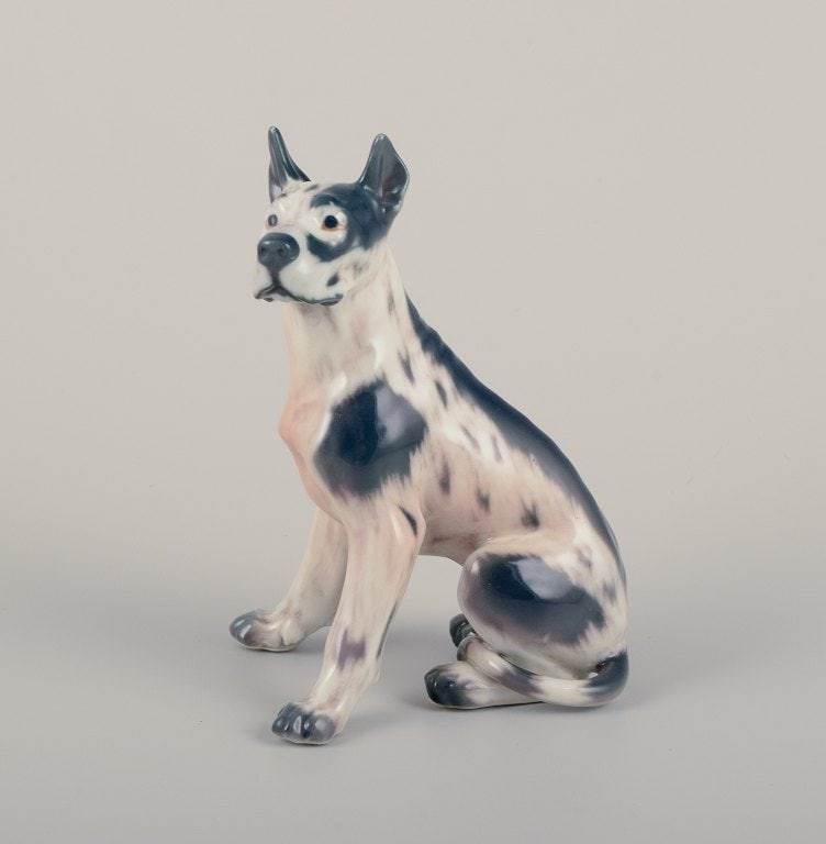 Dahl Jensen, porcelain figurine of a Great Dane.: Dahl Jensen, porcelain figurine of a Great Dane. Model 1128. Approximately from 1930. Marked. First factory quality. Perfect condition. Dimensions: H 12.5 cm x L 9.0 cm. Reserve: $140.00 Shipping: