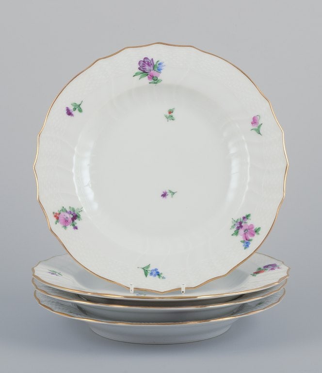 Royal Copenhagen Saxon Flower. Four dinner plates in porcelain. Hand-painted with polychrome: Royal Copenhagen Saxon Flower. Four dinner plates in porcelain. Hand-painted with polychrome flowers. Gold rim. Model: 482/1621 Early 1900s. Marked. In perfect condition. Second factory quality. Dimen