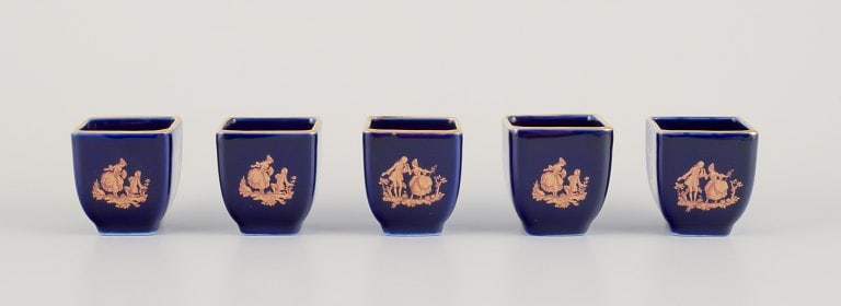 Limoges, France. Five miniature porcelain vases decorated with 22-karat gold leaf and beautiful: Limoges, France. Five miniature porcelain vases decorated with 22-karat gold leaf and beautiful royal blue glaze. Sceƒe¨ne galante. Approximately 1970. Provenance: From a large French private