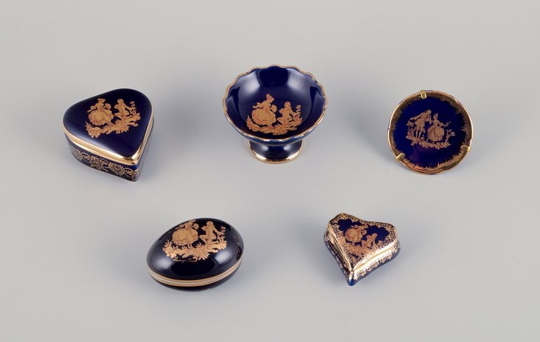 Limoges, France. Five pieces of miniature porcelain decorated with 22-karat gold leaf and beautiful: Limoges, France. Five pieces of miniature porcelain decorated with 22-karat gold leaf and beautiful royal blue glaze. Sceƒe¨ne galante. Approximately 1970. Provenance: From a large French private