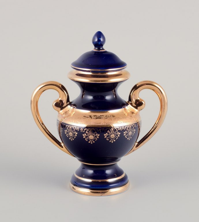Limoges, France. Five pieces of porcelain consisting of a lidded jar, two vases, a lidded - 2