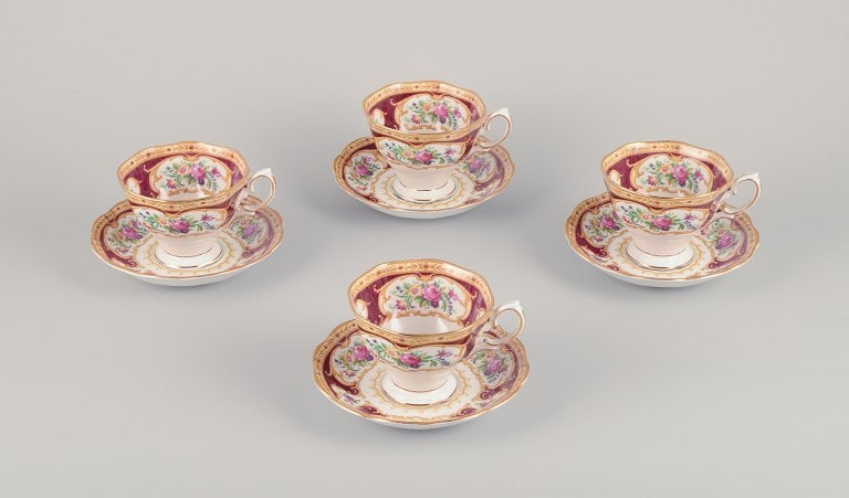 Royal Albert, England. A set of four "Lady Hamilton" coffee cups with saucers. Polychrome floral: Royal Albert, England. A set of four "Lady Hamilton" coffee cups with saucers. Polychrome floral motifs. Gold decoration. Circa 1930s. Marked. In excellent condition with minimal signs of use. Cup:
