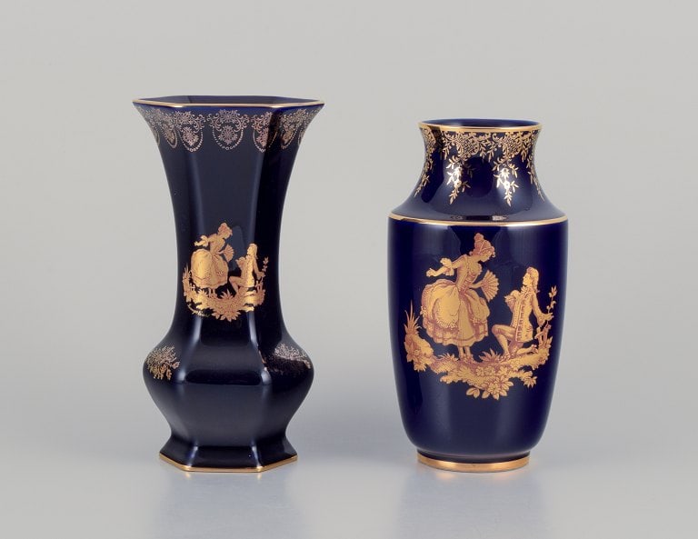 Limoges, France. Two porcelain vases decorated with 22-karat gold leaf and beautiful royal blue: Limoges, France. Two porcelain vases decorated with 22-karat gold leaf and beautiful royal blue glaze. Sceƒe¨ne galante. Approximately 1970. Provenance: From a large French private collection of