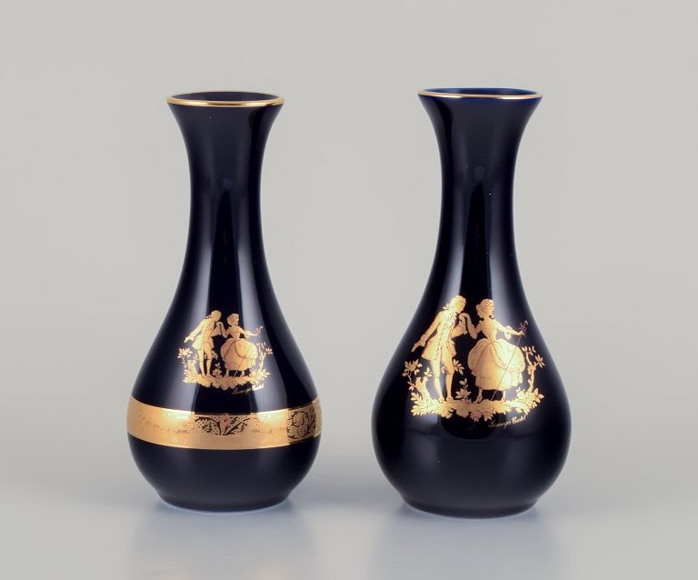 Limoges, France. Two porcelain vases decorated with 22-karat gold leaf and beautiful royal blue: Limoges, France. Two porcelain vases decorated with 22-karat gold leaf and beautiful royal blue glaze. Sceƒe¨ne galante. Approximately 1970. Provenance: From a large French private collection of