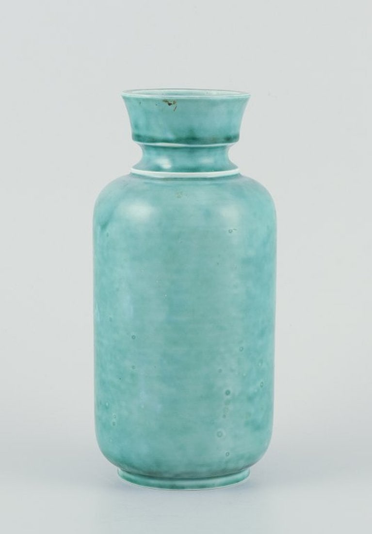 Wilhelm Kage for Gustavsberg, Sweden. Large 'Argenta' series stoneware vase. Hand-turned, glazed in: Wilhelm Kage for Gustavsberg, large stoneware vase. Argentaseries. Hand-turned, glazed in green tones. Marked. Mid 20th century. in good condition, with a small and insignificant chip at the bottom of