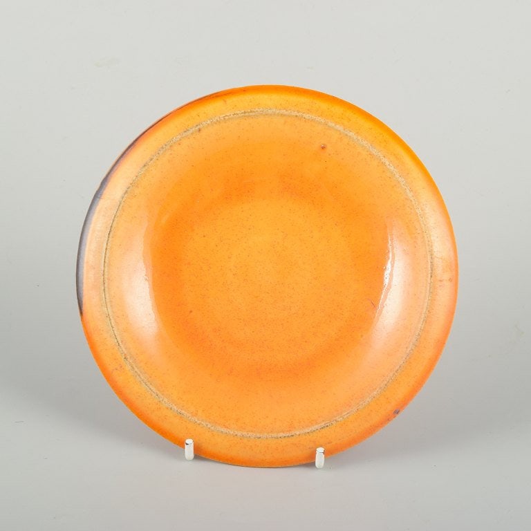 Svend Hammershoi for Kahler, Denmark. Small dish in earthenware with uranium glaze. 1930s.: Svend Hammershoi for Kahler, dish with uranium glaze. Small dish designed by Svend Hammershoi for Kahler, made in the 1930s. Glazed in a warm, deep orange uranium glaze with fine depth of colour and