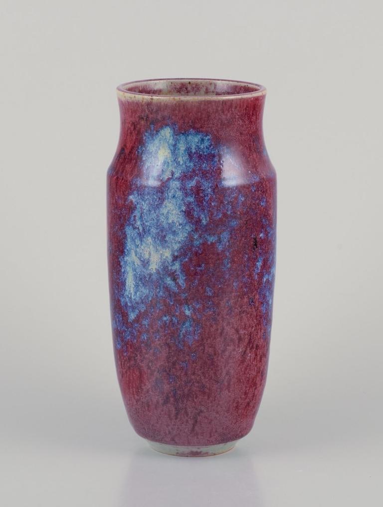 French ceramicist. Ceramic vase with glaze in shades of blue-violet. Mid-20th C.: French ceramicist. Unique ceramic vase. Glaze in shades of blue-violet. Mid-20th century. Perfect condition with natural craquelure. indistinctly signed. Dimensions: H 20.5 x D 8.0 cm.; French