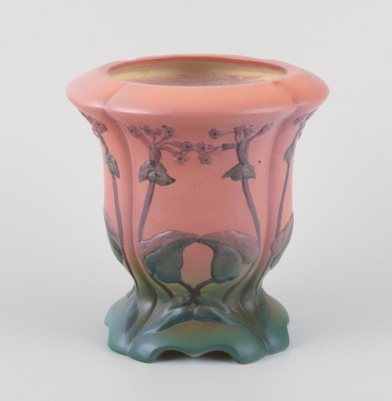 Ipsens, Denmark. Ceramic vase with floral motifs in orange and green glaze. 1920s/1930s.: Ipsens, Denmark, ceramic vase with orange and green glaze. Floral motifs in relief. Late Art Nouveau. Model number 703. Date: 1920s/1930s. Marked. in excellent condition. Dimensions: D 18.0 x H 19.0