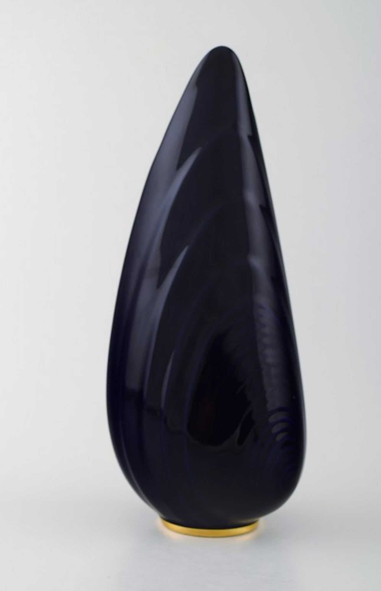 Upsala-Ekeby / Karlskrona. Ceramic Vase, navy blue glaze with gold decoration at the bottom.: Upsala-Ekeby / Karlskrona. Ceramic Vase, navy blue glaze with gold decoration at the bottom. Clamshell shaped. Stamped. Sweden 1960 s. in perfect condition. Measures 29 cm. x 10 cm.; Upsala-Ekeby /
