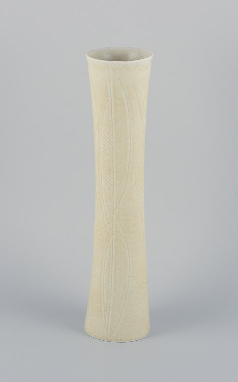 Carl Harry Stalhane for Rorstrand, tall and slender ceramic vase decorated with geomaetric pattern: Carl Harry Stalhane for Rorstrand, tall and slender ceramic vase decorated with geometric pattern and cream-colored glaze. Mid-20th century. Marked. in good condition, with a minimal and